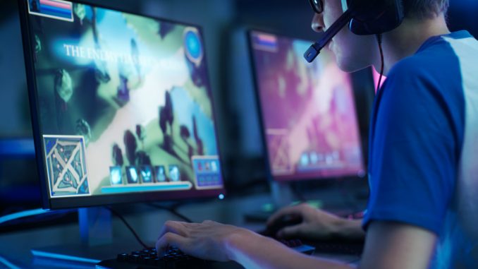 Team of Professional eSport Gamers Playing in Competitive MMORPG/ Strategy Video Game on a Cyber Games Tournament. They Talk to Each other into Microphones. Arena Looks Cool with Neon Lights.